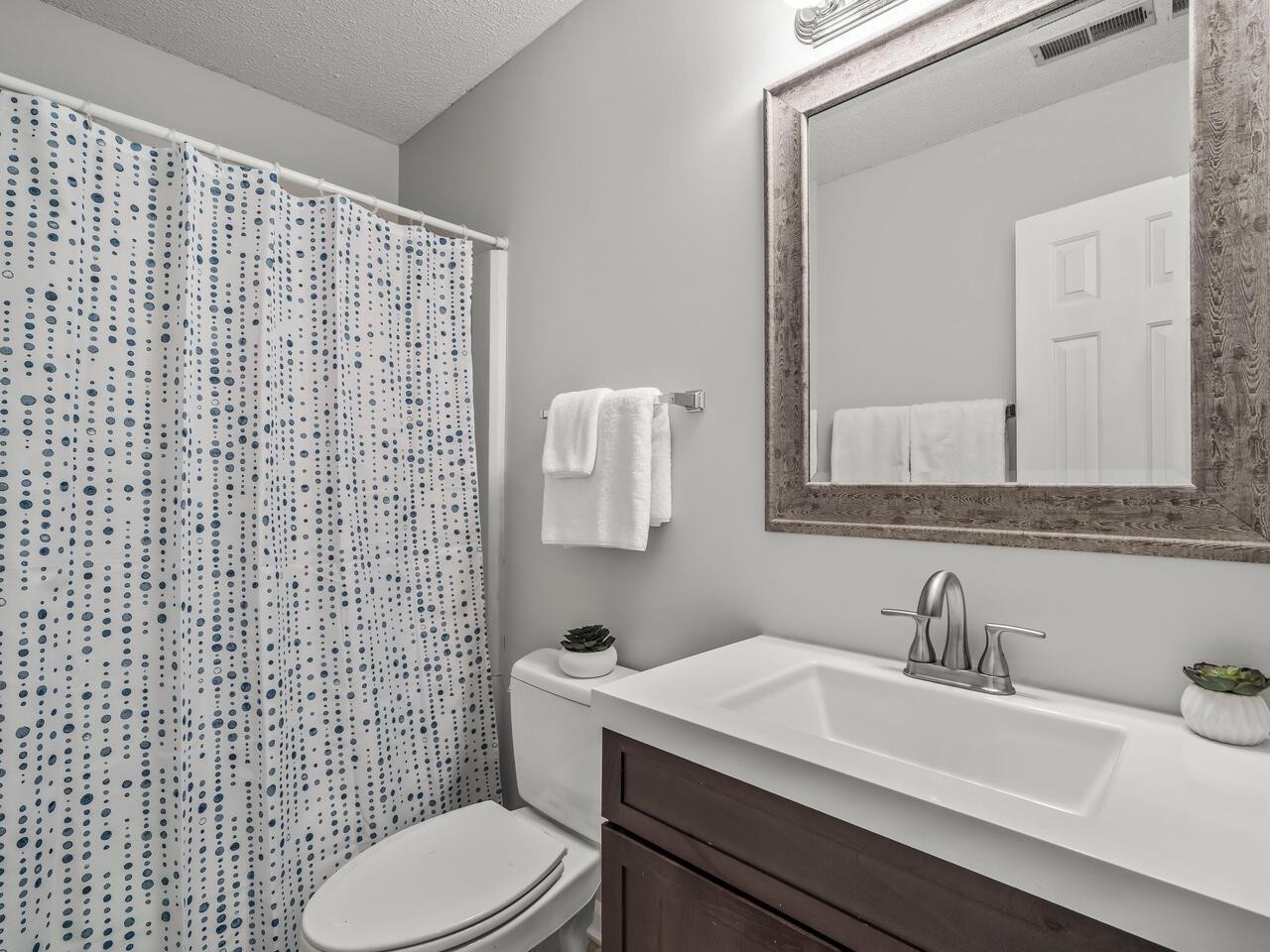 118 Shady Spring Place Durham, NC 27713 - Photo 20 of 33 a bathroom with a sink a toilet and a mirror