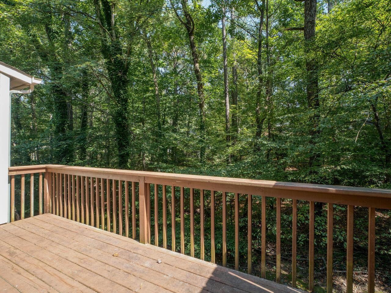 118 Shady Spring Place Durham, NC 27713 - Photo 25 of 33 a balcony with wooden floor and fence