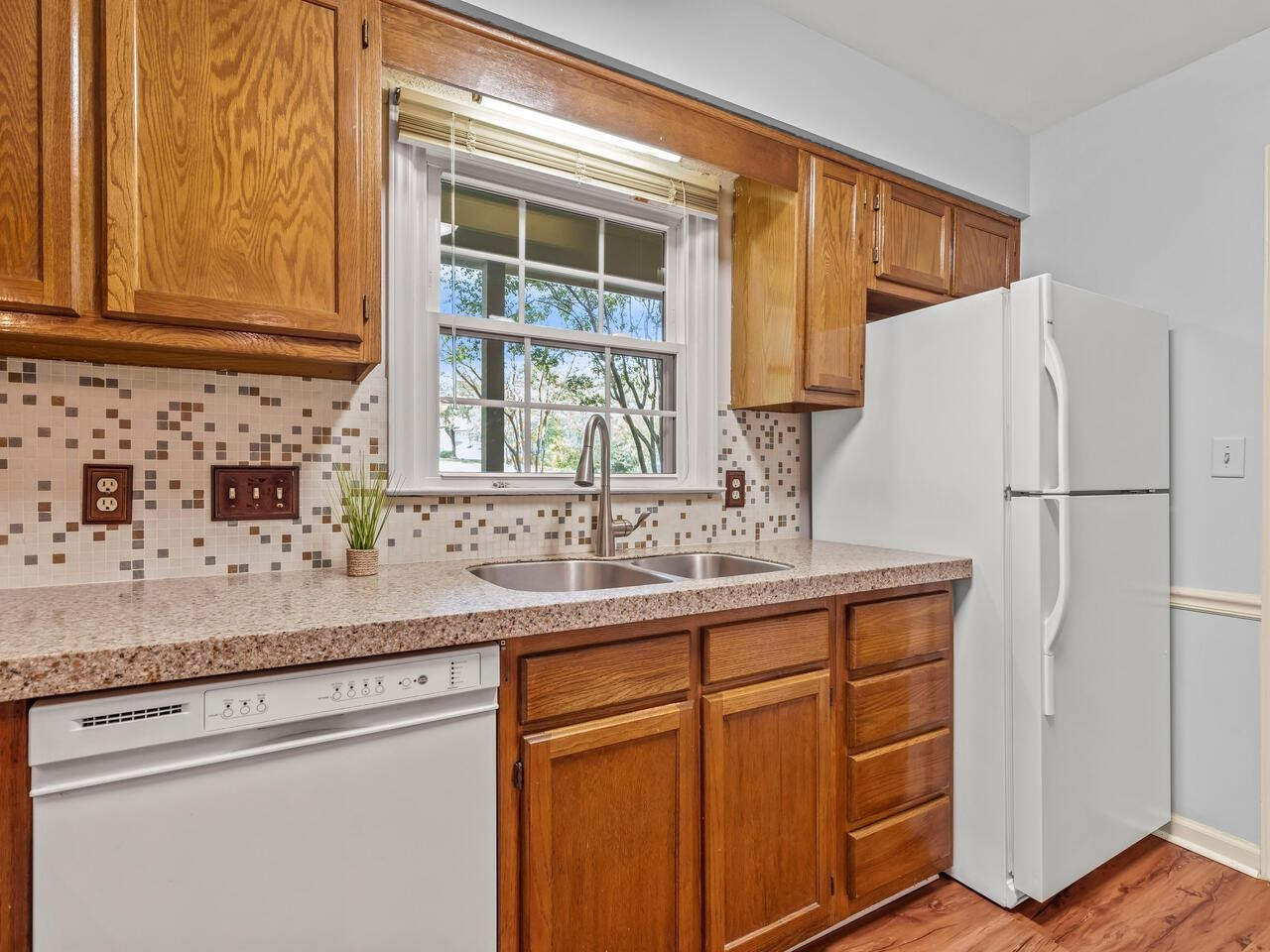 118 Shady Spring Place Durham, NC 27713 - Photo 7 of 33 a kitchen with stainless steel appliances granite countertop a sink and a refrigerator