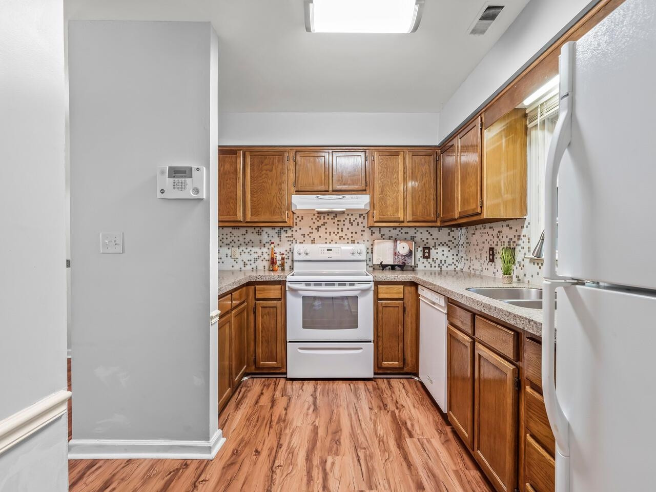 118 Shady Spring Place Durham, NC 27713 - Photo 10 of 33 a kitchen with granite countertop a sink stove and refrigerator
