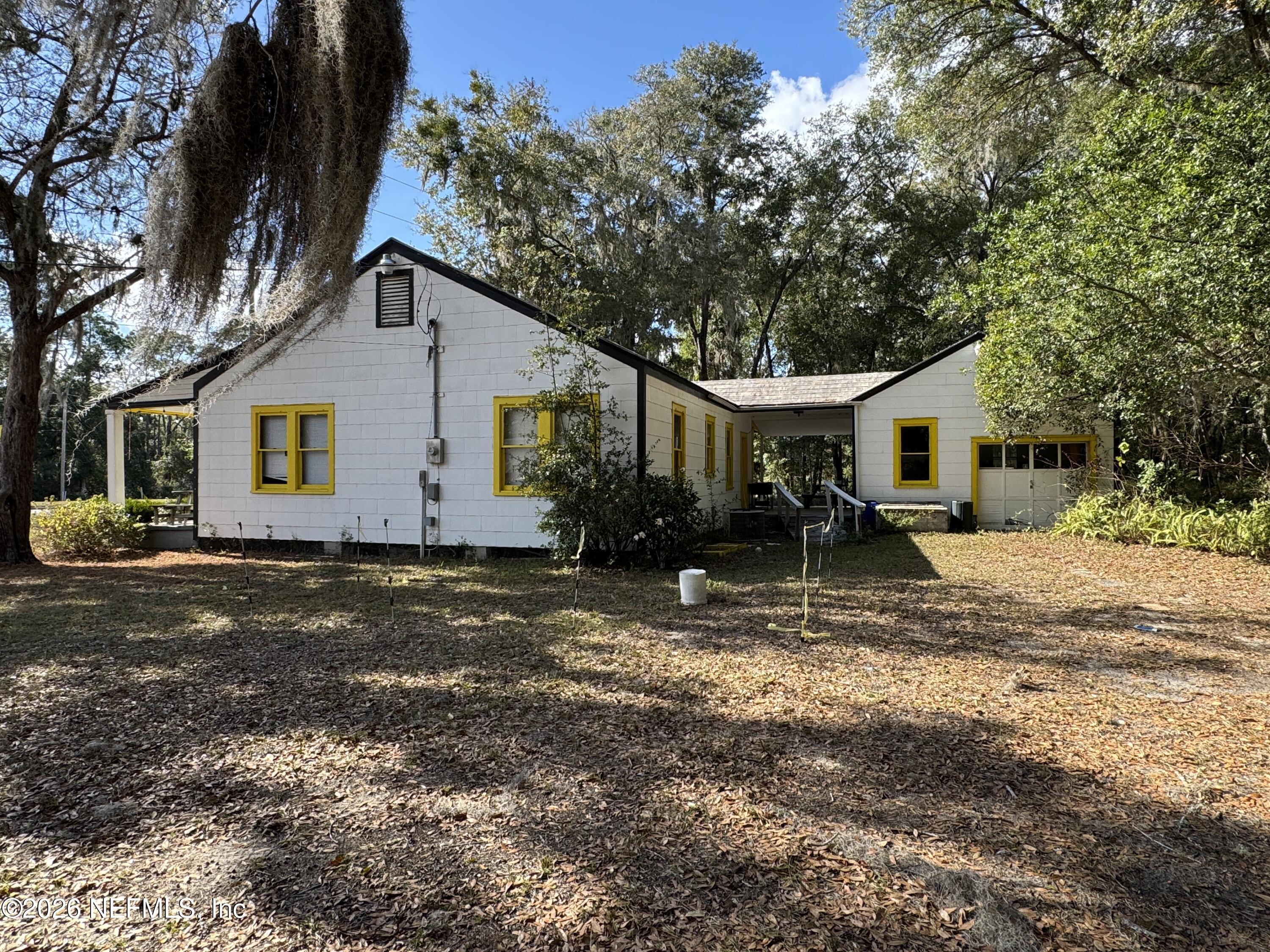 1042 Highway 20 Interlachen, FL 32148 - Photo 3 of 10 a view of a house with a yard