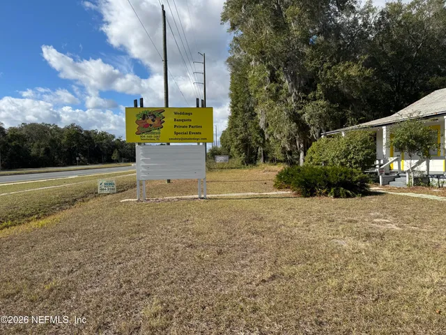 a view of a parking space in front of a house