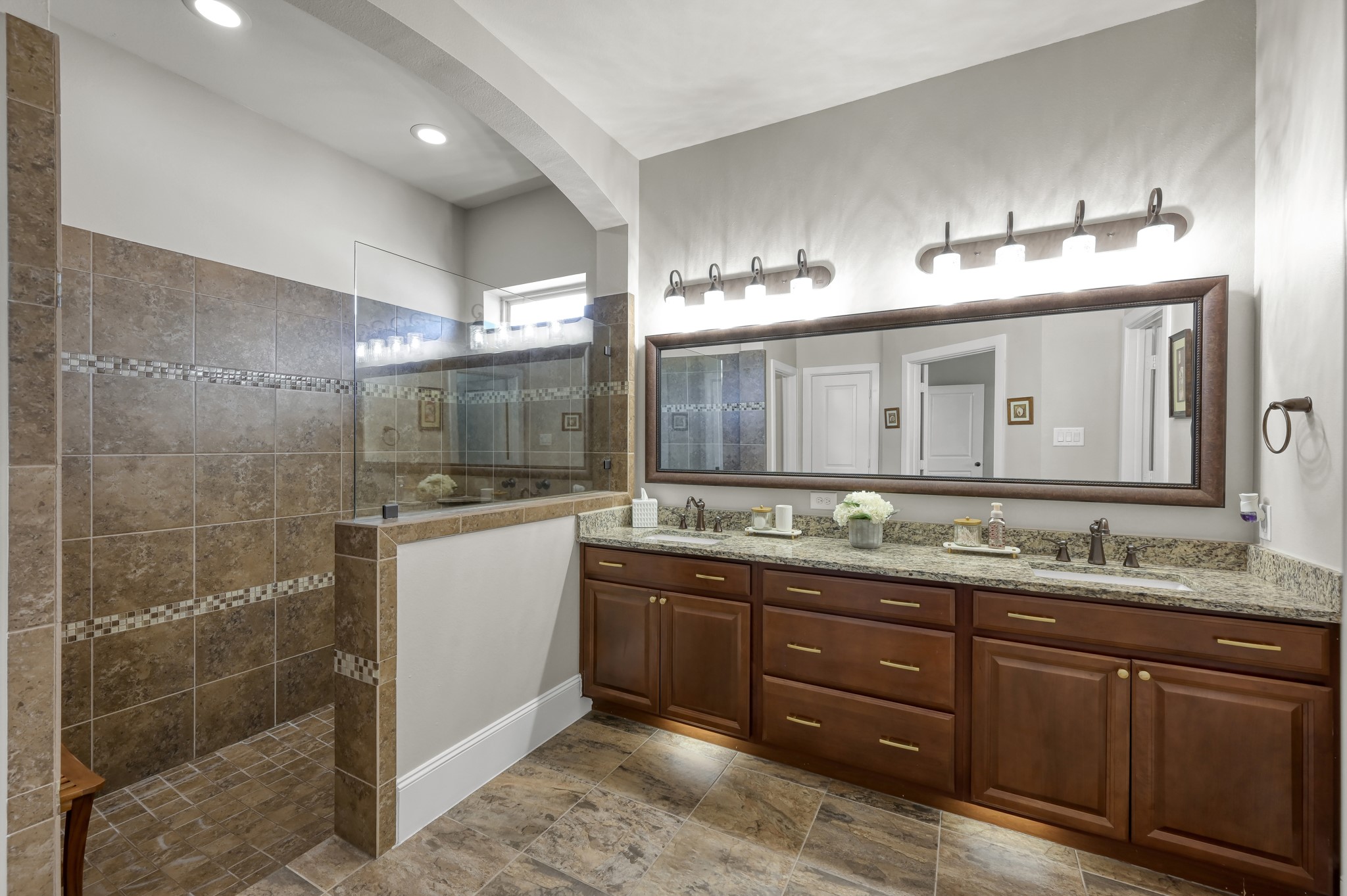 31742 Serrano Bluff Lane Spring, TX 77386 - Photo 13 of 40 Primary bathroom offers a SUPER shower, Dual sinks and undercabinet lighting.