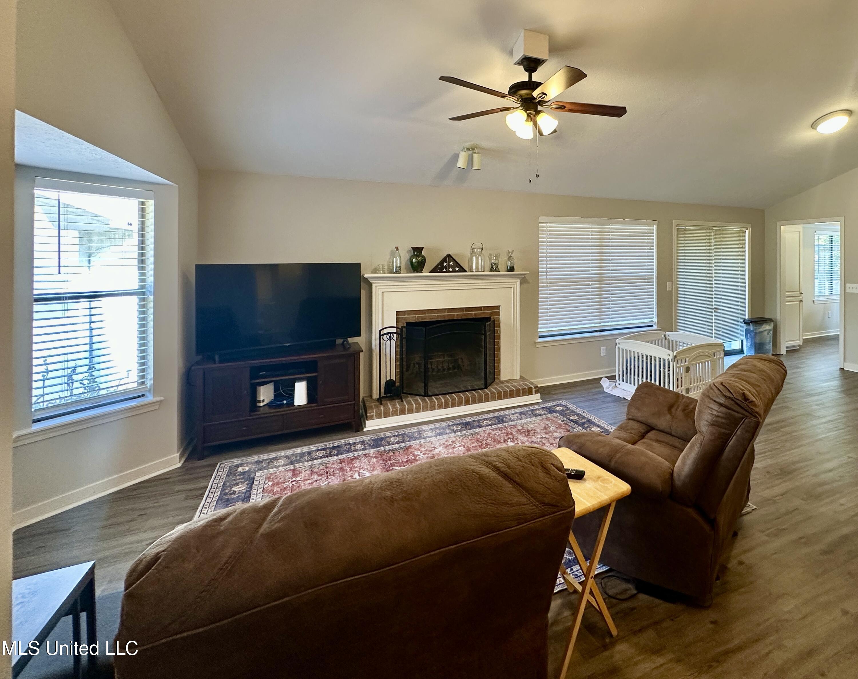 157 Caribbean Cove Clinton, MS 39056 - Photo 19 of 39 Gatherinf room with fireplace