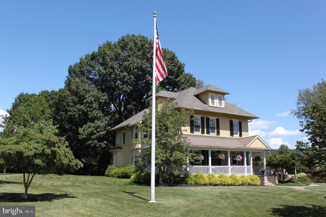 1571 North Valley Road Malvern, PA 19355 - Photo 4 of 93 Main house with wrap around porch and flagpole!