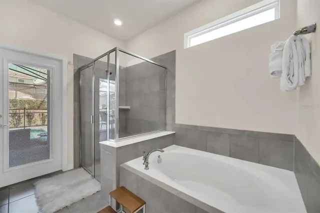 a living room with furniture and a painting on the wall