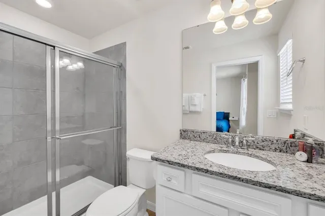 a bathroom with a shower and a toilet