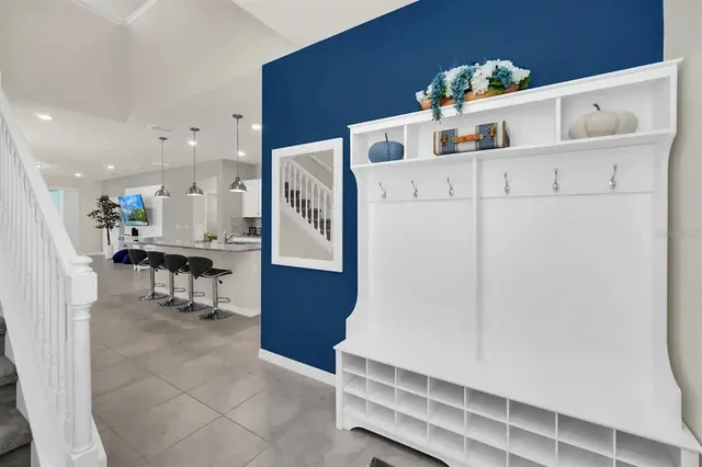 a kitchen with stainless steel appliances granite countertop a sink a stove and a refrigerator