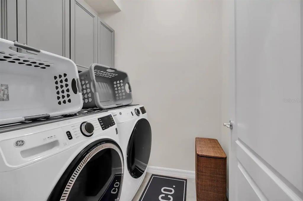 7263 Oakmoss Loop Davenport, FL 33837 - Photo 44 of 57 a view of washer and dryer