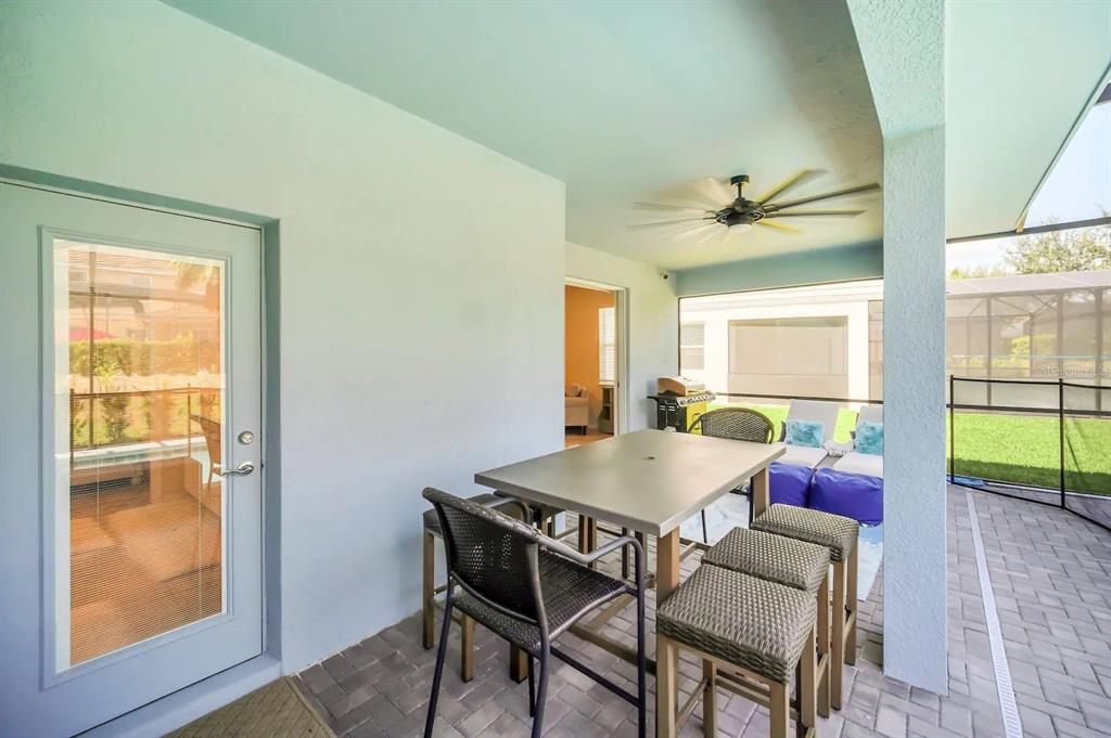 7263 Oakmoss Loop Davenport, FL 33837 - Photo 48 of 57 a dining room with furniture and window