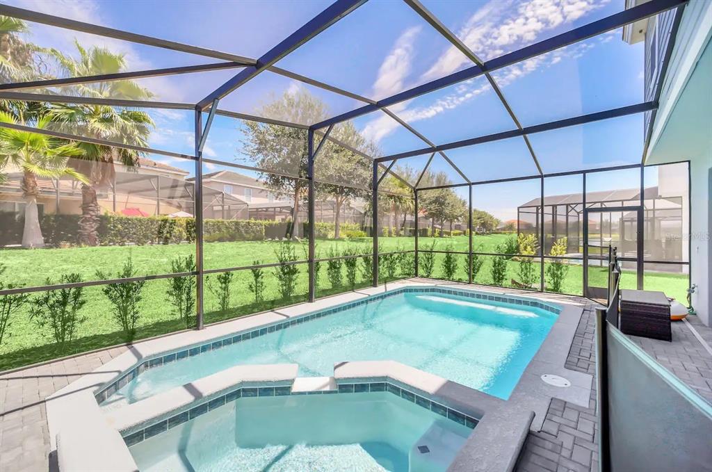 7263 Oakmoss Loop Davenport, FL 33837 - Photo 50 of 57 a view of a backyard with a swimming pool