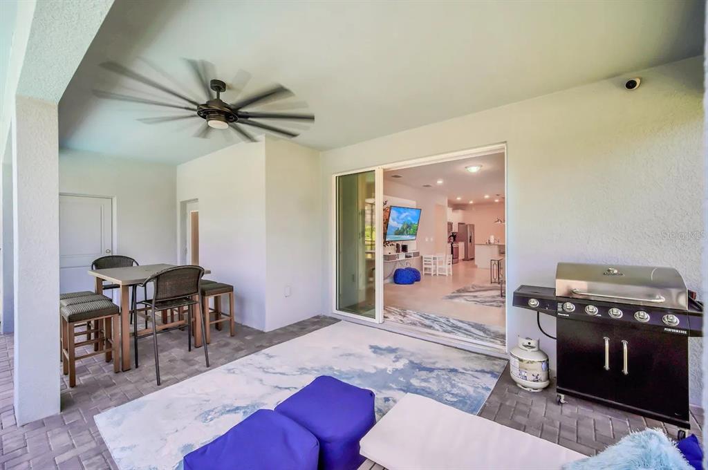 7263 Oakmoss Loop Davenport, FL 33837 - Photo 51 of 57 a living room with furniture and a wooden floor