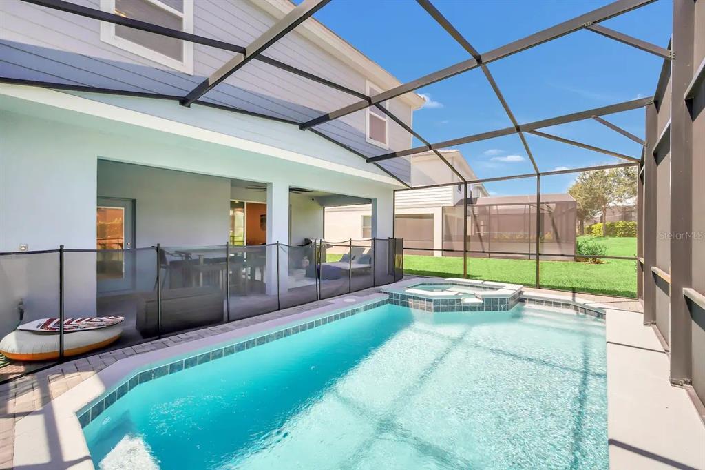 7263 Oakmoss Loop Davenport, FL 33837 - Photo 55 of 57 a view of swimming pool with outdoor seating