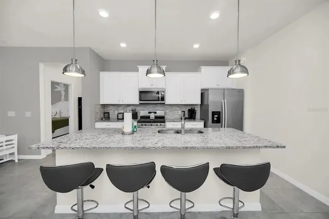 a view of a dining room with furniture and window