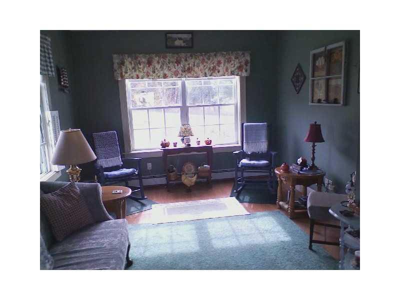 807 Gardiner Road Wales, ME 04280 - Photo 16 of 32 Living Room. Sun filled home.