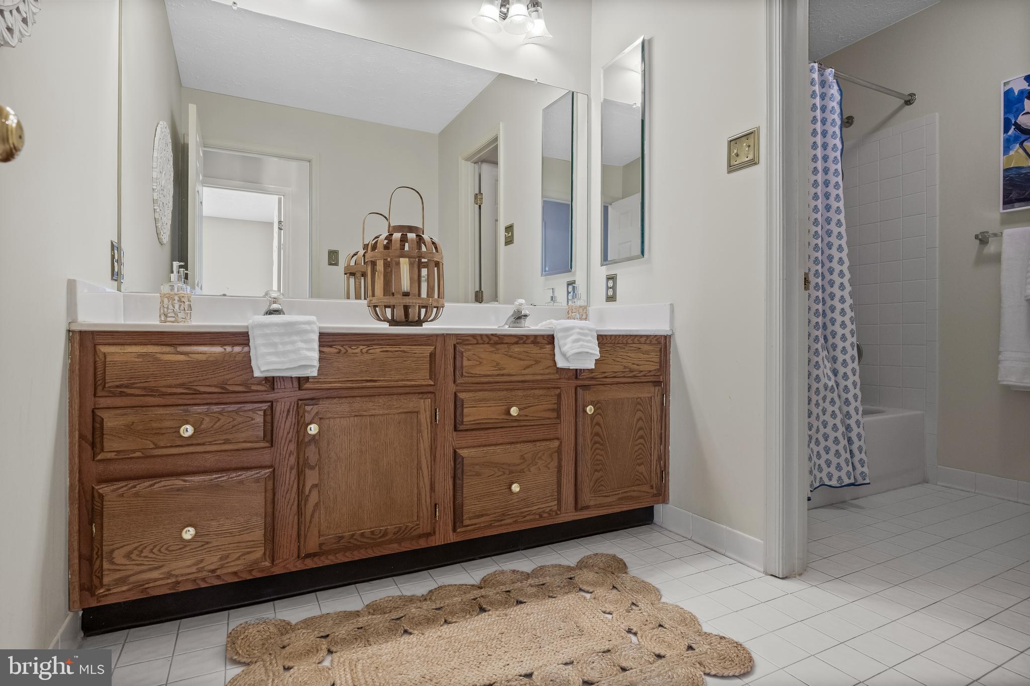 154 Preakness Drive Mount Laurel, NJ 08054 - Photo 34 of 49 a spacious bathroom with a granite countertop sink and a mirror