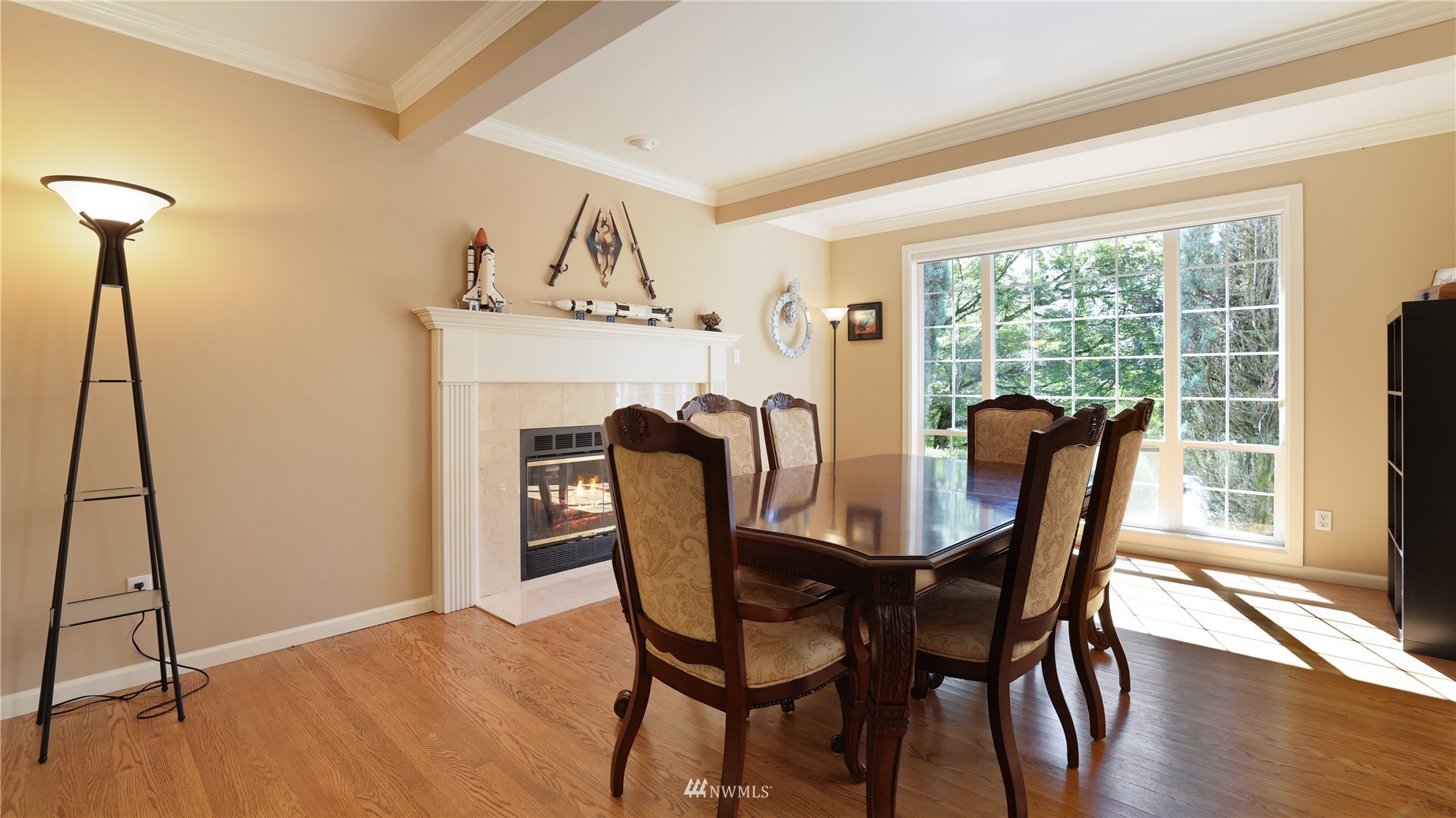 16038 Southeast 125th Street Renton, WA 98059 - Photo 11 of 34 a view of a dining room with furniture window and wooden floor