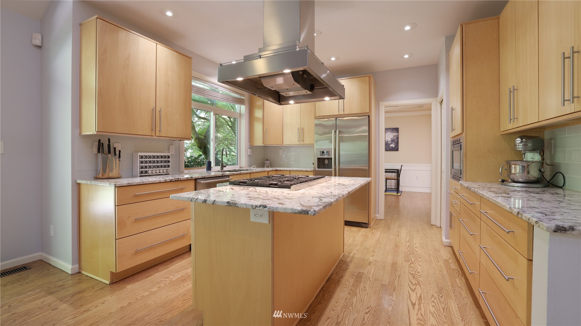 16038 Southeast 125th Street Renton, WA 98059 - Photo 16 of 34 a kitchen with kitchen island granite countertop a stove and a sink