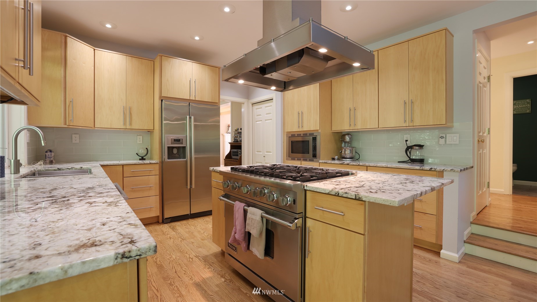 16038 Southeast 125th Street Renton, WA 98059 - Photo 17 of 34 a kitchen with a stove and a sink