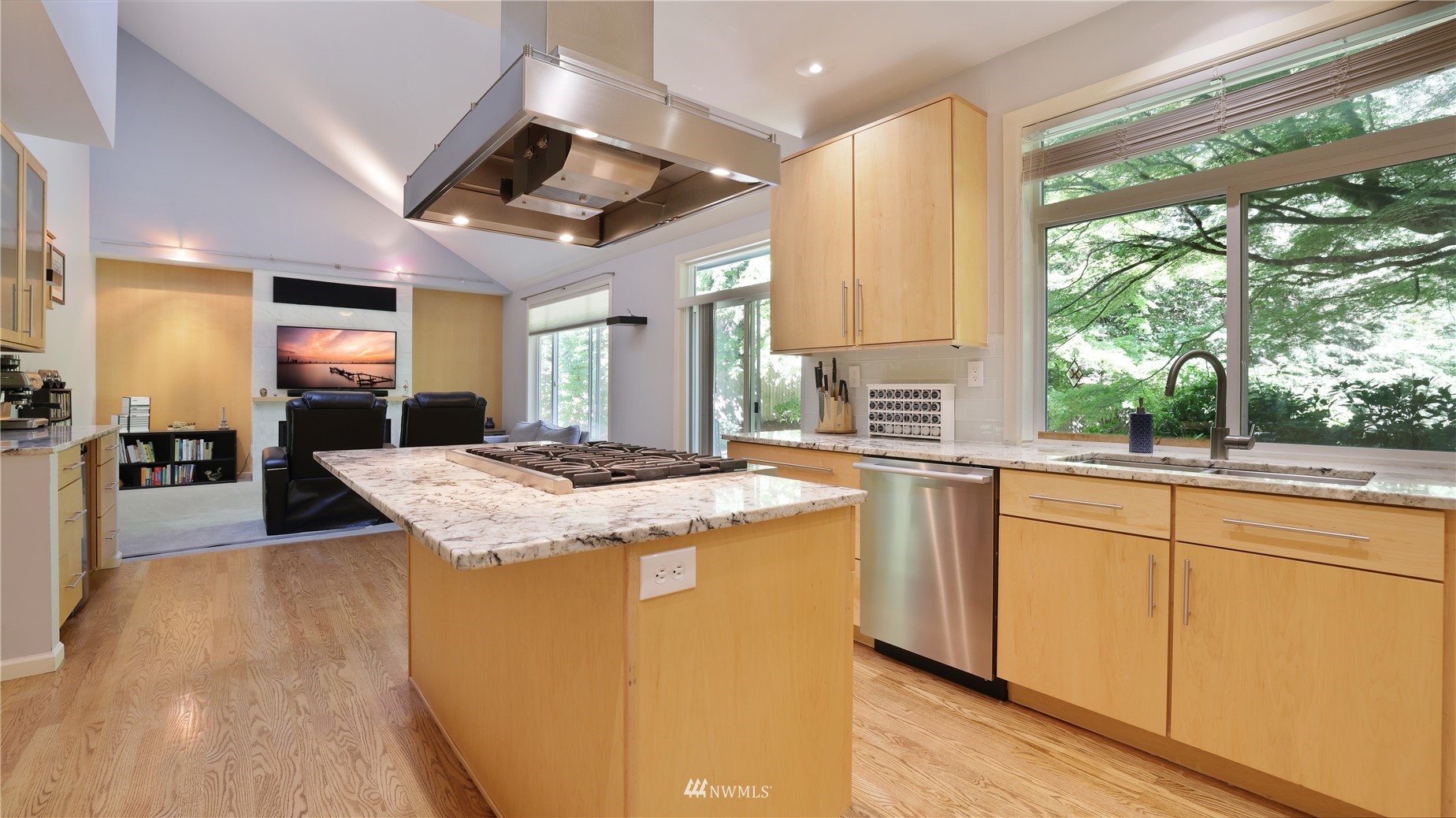16038 Southeast 125th Street Renton, WA 98059 - Photo 18 of 34 a kitchen with kitchen island a large counter top space appliances and a large window