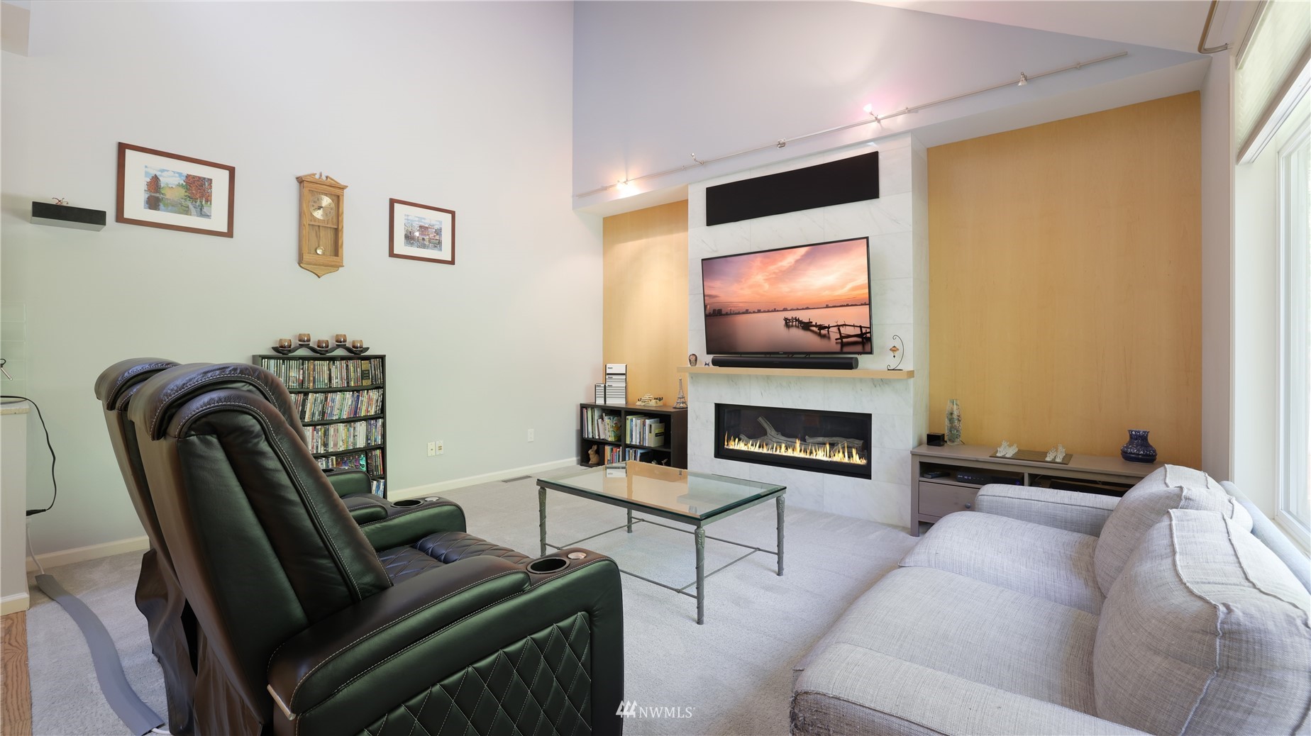 16038 Southeast 125th Street Renton, WA 98059 - Photo 21 of 34 a living room with furniture a fireplace and a flat screen tv