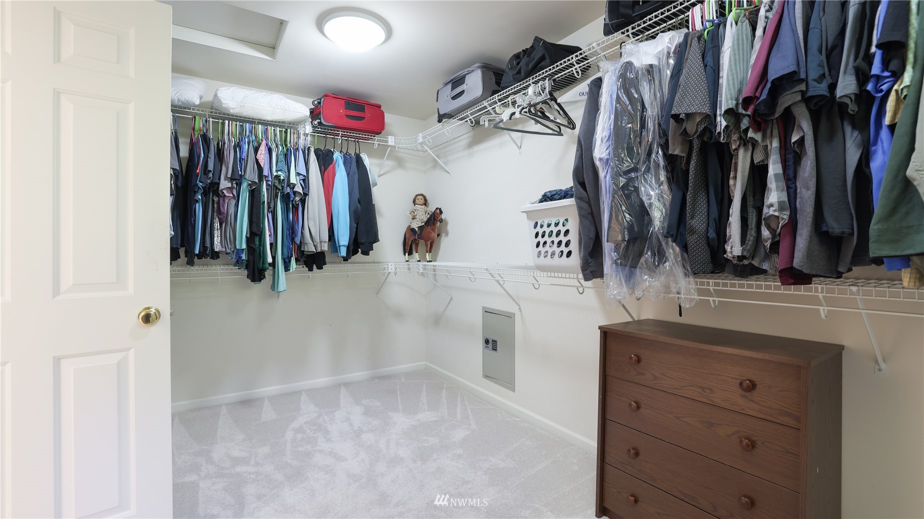 16038 Southeast 125th Street Renton, WA 98059 - Photo 25 of 34 a view of walk in closet with clothes and shoes