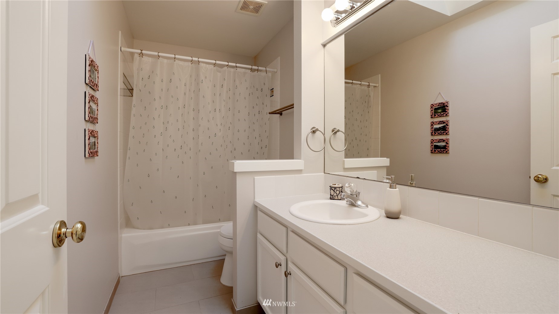 16038 Southeast 125th Street Renton, WA 98059 - Photo 30 of 34 a bathroom with a sink a toilet and shower