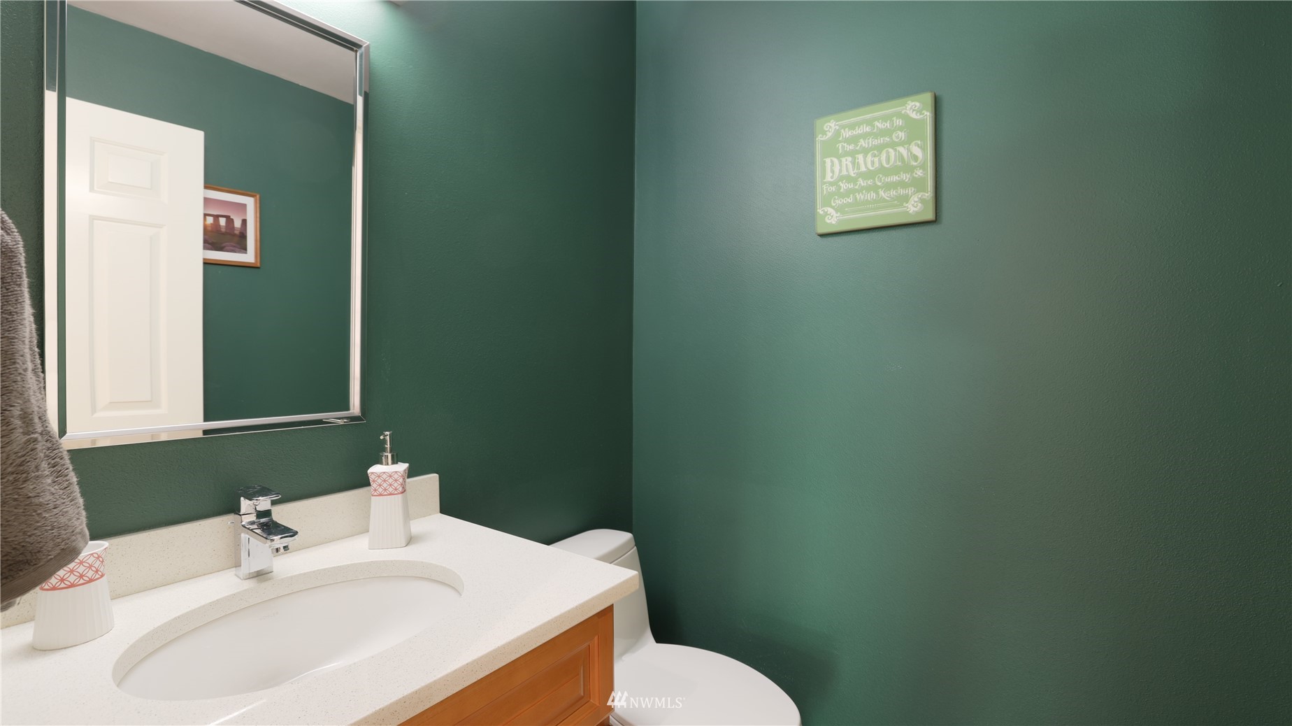 16038 Southeast 125th Street Renton, WA 98059 - Photo 32 of 34 a bathroom with a sink mirror and toilet