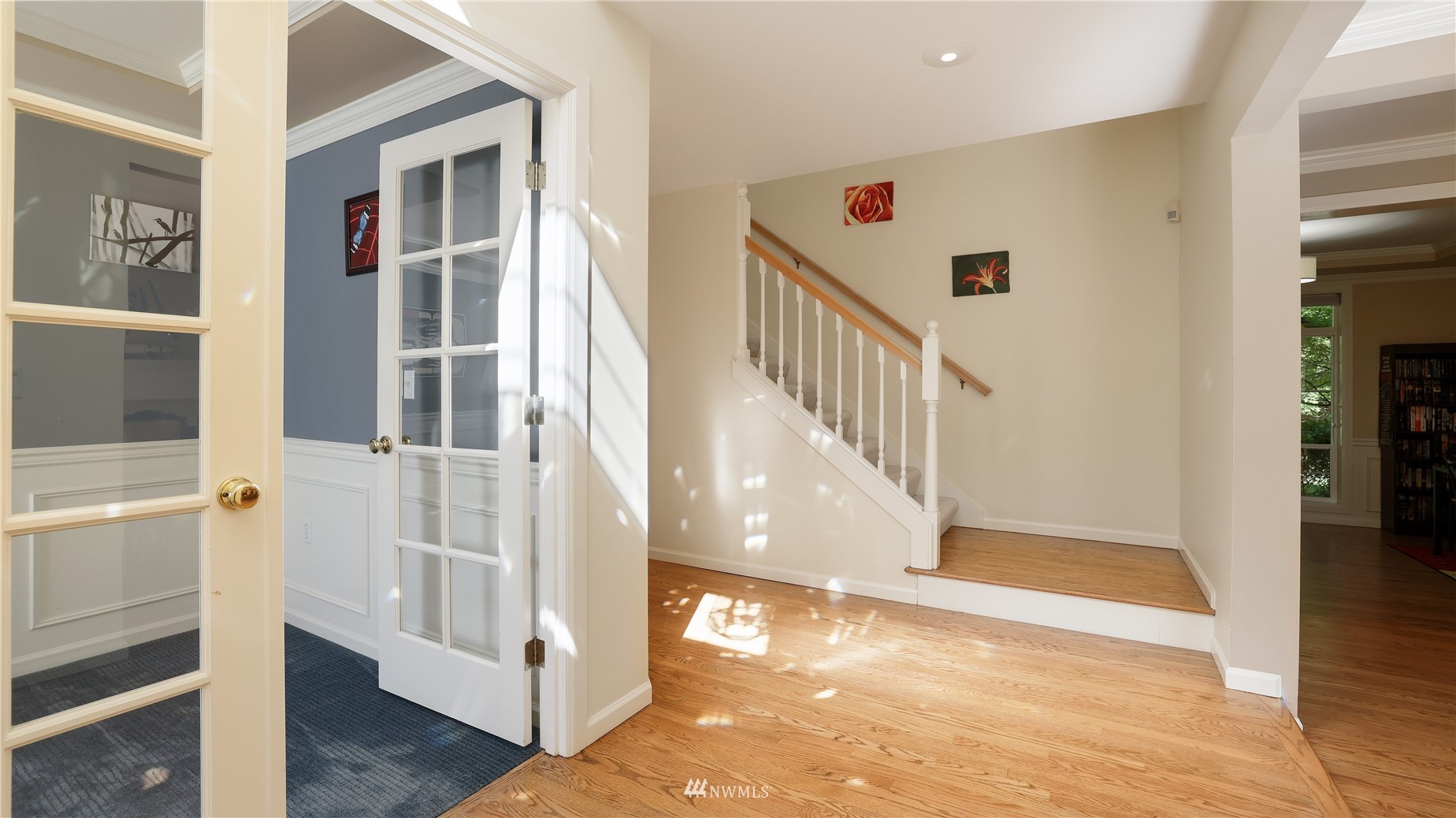16038 Southeast 125th Street Renton, WA 98059 - Photo 10 of 34 a view of a hallway with wooden floor and staircase