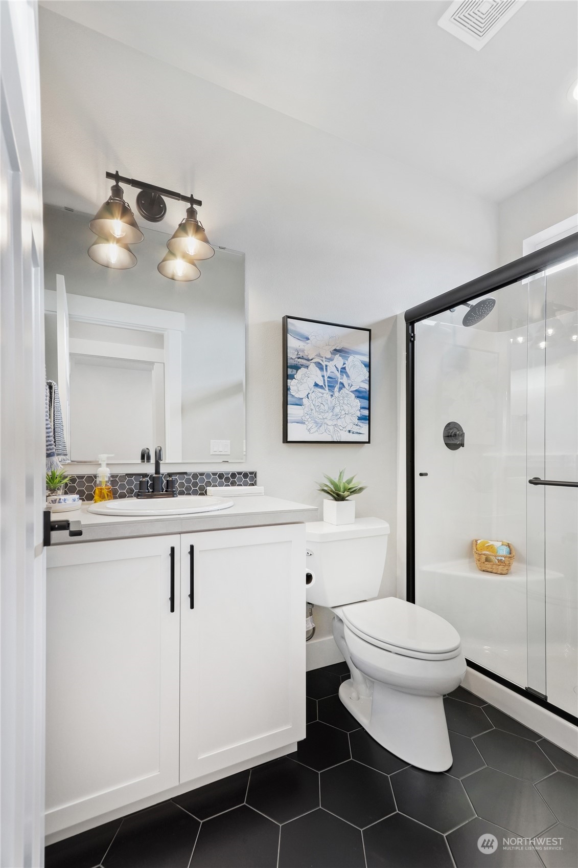 4411 242nd Place Southeast, Unit SL 15 Bothell, WA 98021 - Photo 12 of 32 a bathroom with a sink a toilet and a mirror