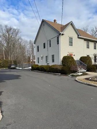 a view of multiple house with a street
