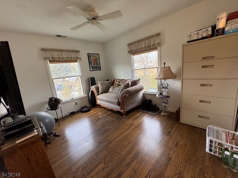 630 Valley Road Gillette, NJ 07933 - Photo 23 of 30 a living room with furniture window and a wooden floor