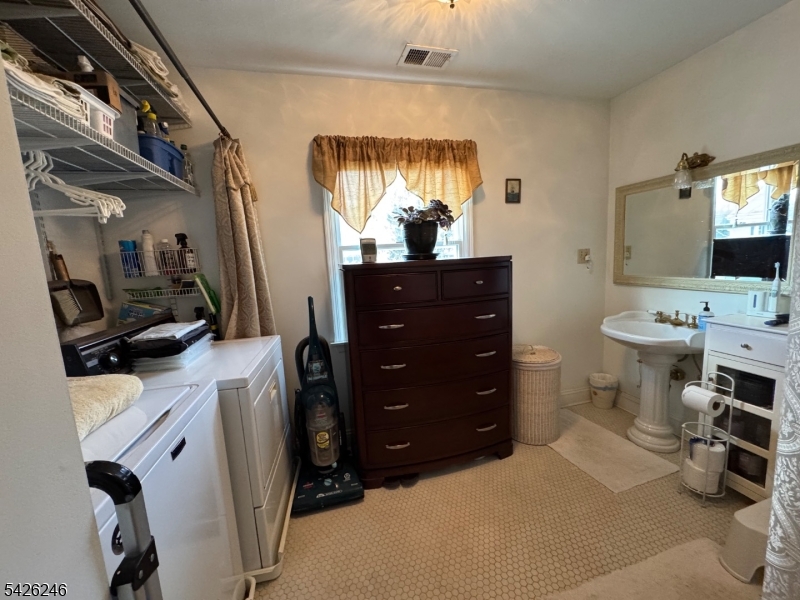 630 Valley Road Gillette, NJ 07933 - Photo 24 of 30 a room with a flat screen tv and a dresser