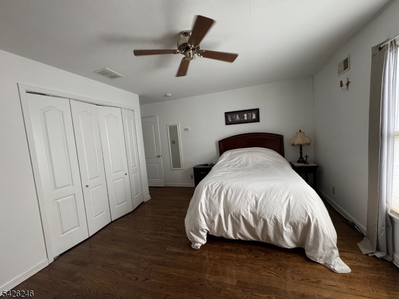 630 Valley Road Gillette, NJ 07933 - Photo 26 of 30 a bed sitting in a bedroom next to a cabinet