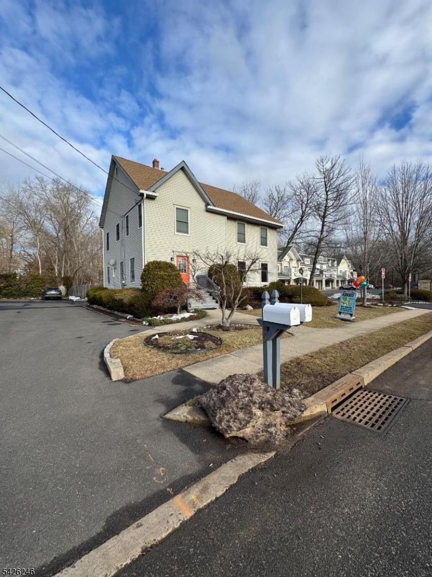 630 Valley Road Gillette, NJ 07933 - Photo 3 of 30 a front view of a building with parking area