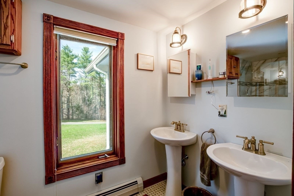 205 East Rindge Road Ashburnham, MA 01430 - Photo 28 of 40 a bathroom with a sink and a mirror