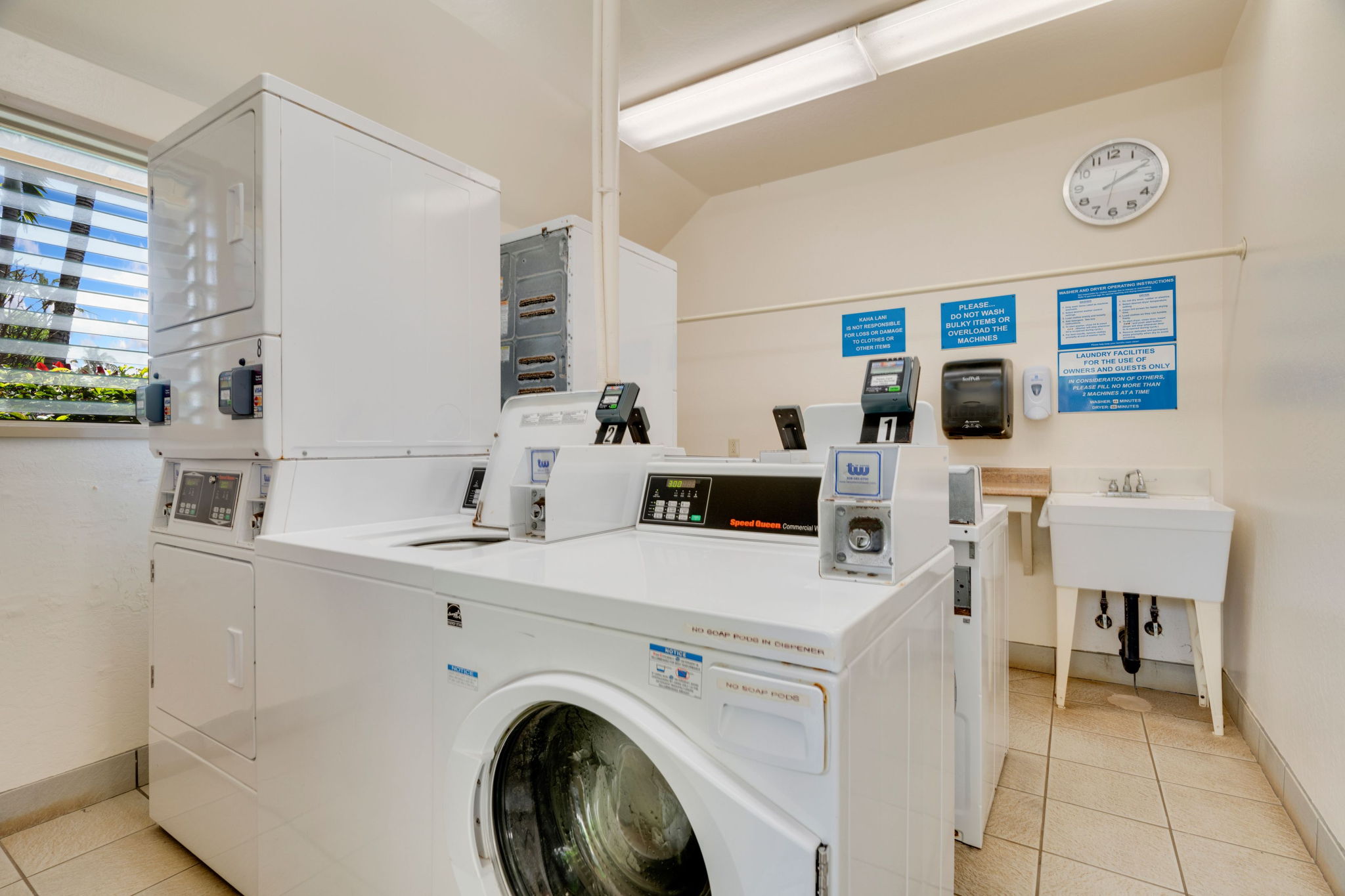 4460 Nehe Road, Unit 203 Lihue, HI 96766 - Photo 21 of 26 a utility room with dryer and washer