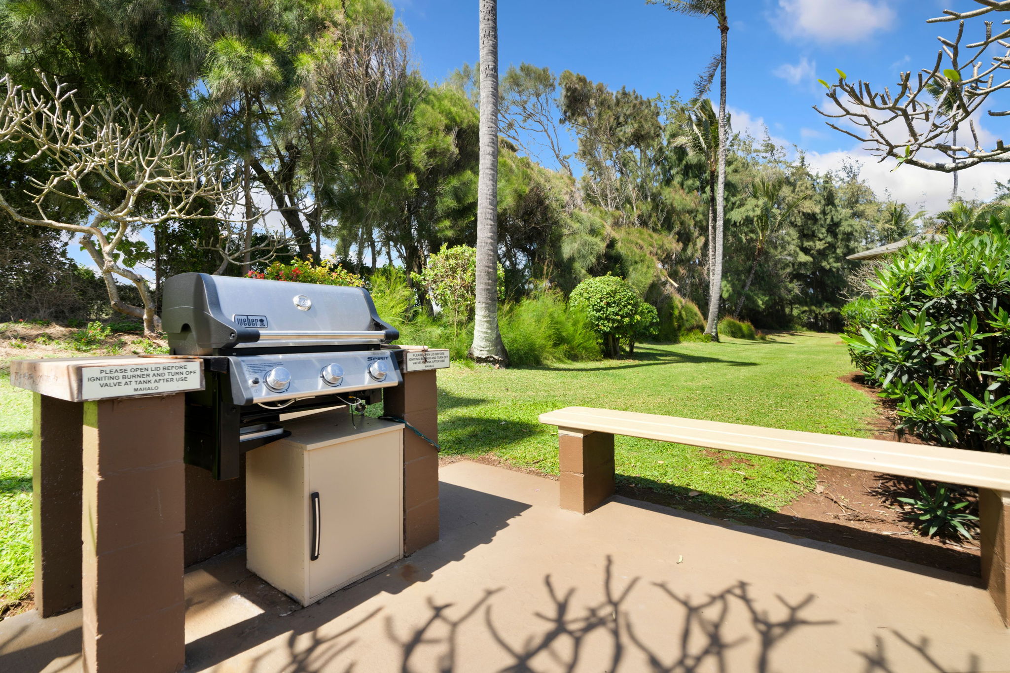 4460 Nehe Road, Unit 203 Lihue, HI 96766 - Photo 22 of 26 a view of a chairs and table in patio with wooden fence