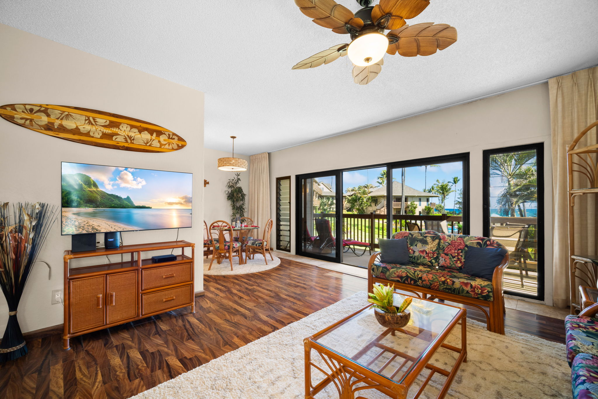 4460 Nehe Road, Unit 203 Lihue, HI 96766 - Photo 4 of 26 a living room with fireplace furniture and a large window