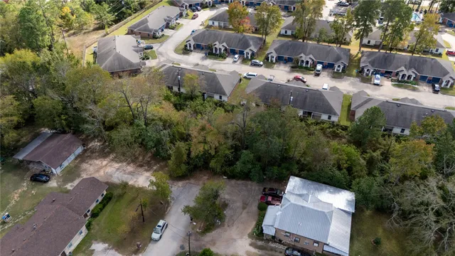 an aerial view of residential house with outdoor space and swimming pool