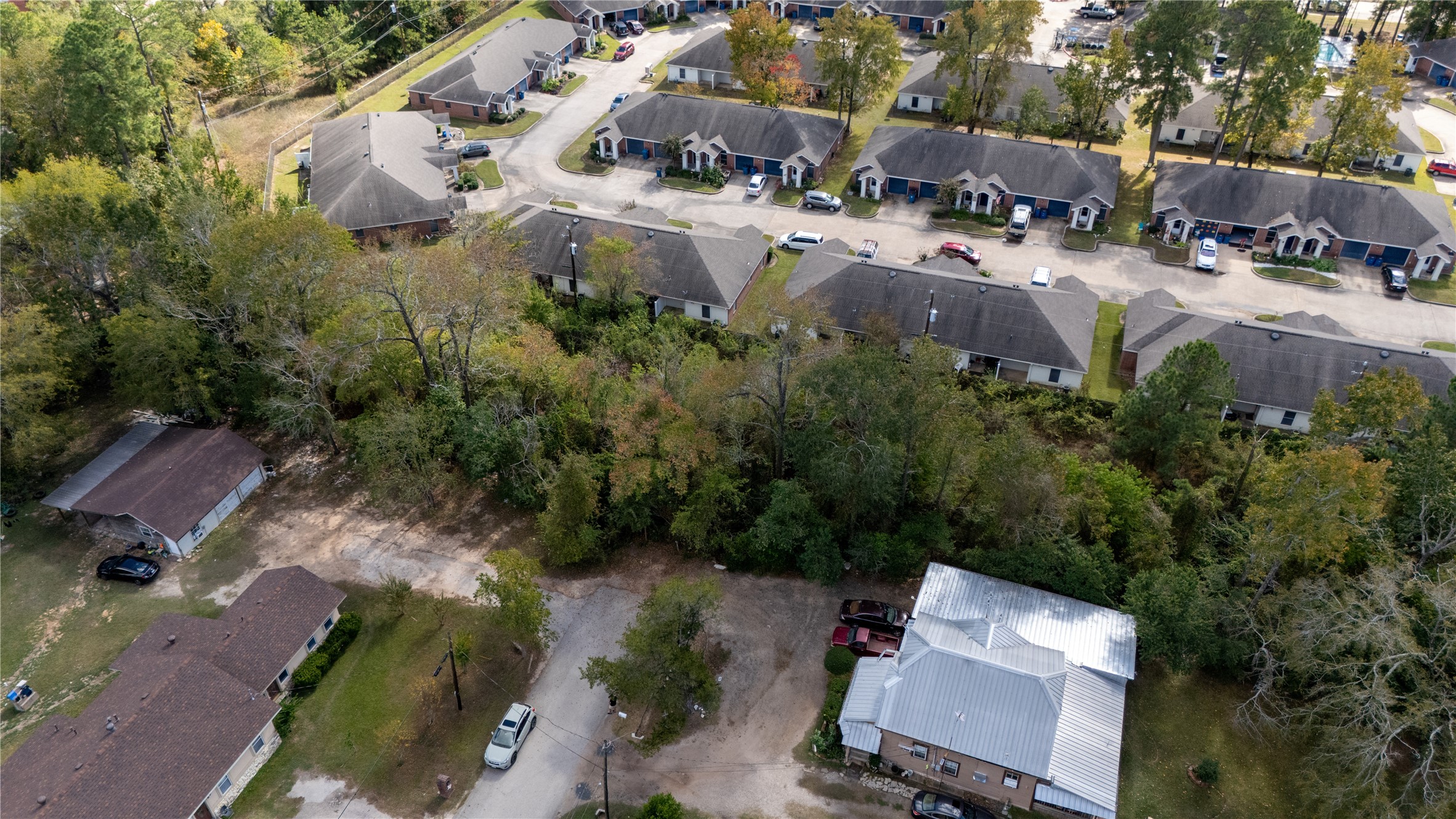 0 South Sandra Street Conroe, TX 77301 - Photo 11 of 14 an aerial view of multiple houses with yard