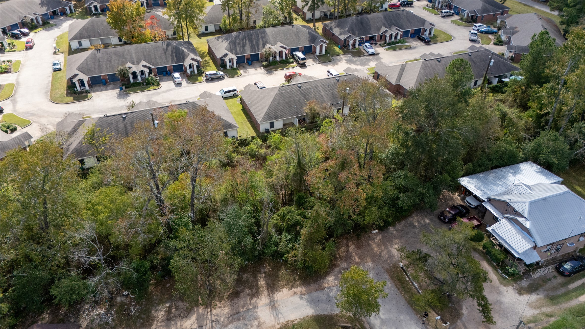 0 South Sandra Street Conroe, TX 77301 - Photo 13 of 14 an aerial view of residential house with outdoor space and trees all around