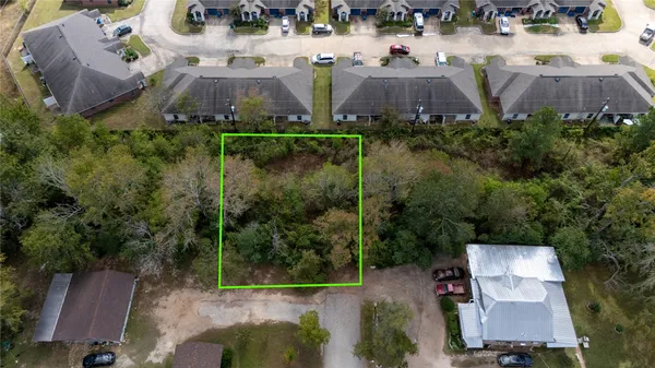 an aerial view of house with yard and outdoor space