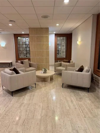 a view of an empty room with kitchen