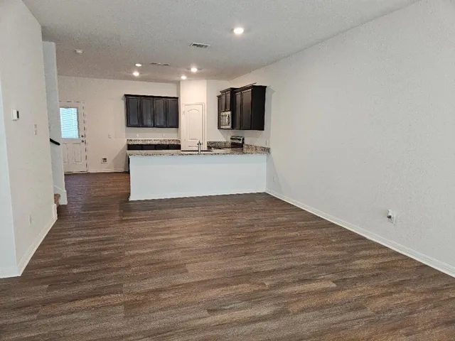 a view of a lake with houses in front of it