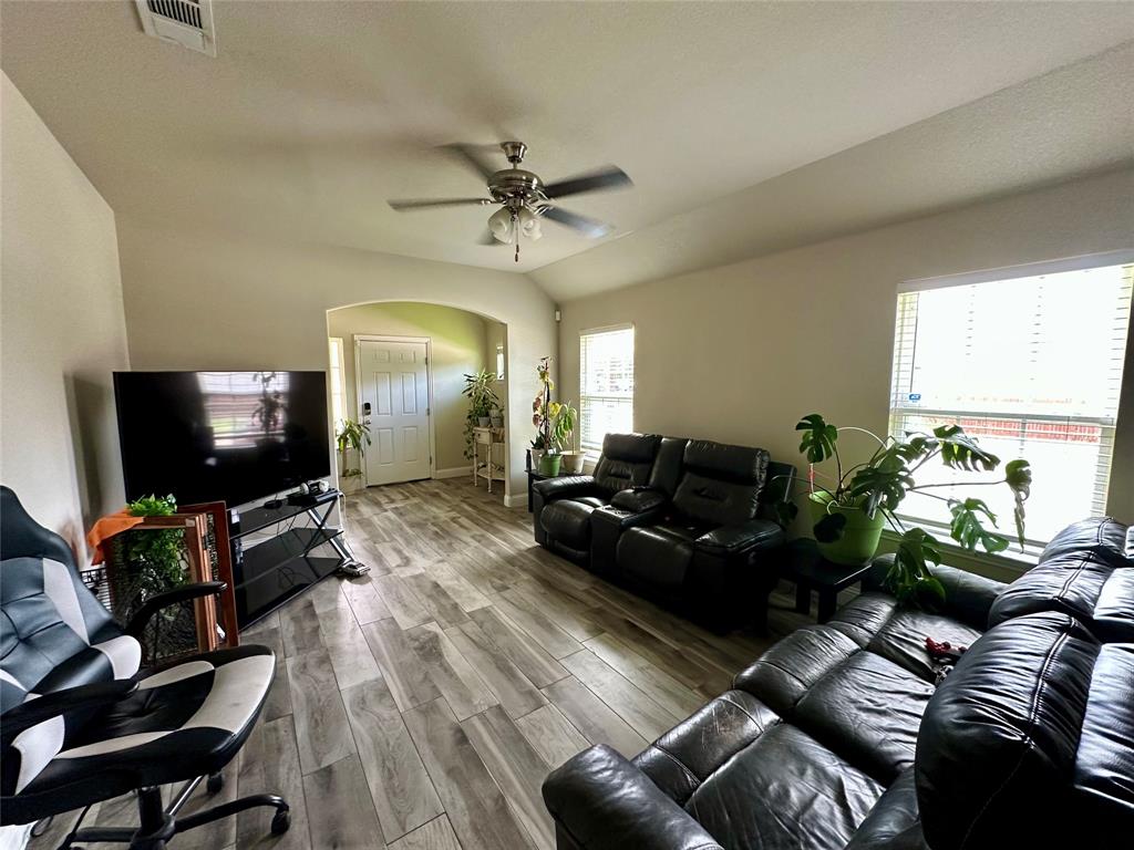2801 Stuart Drive Fort Worth, TX 76104 - Photo 11 of 39 a living room with furniture and a flat screen tv