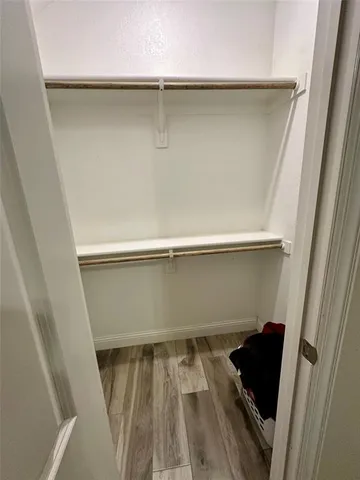 an empty room with wooden floor