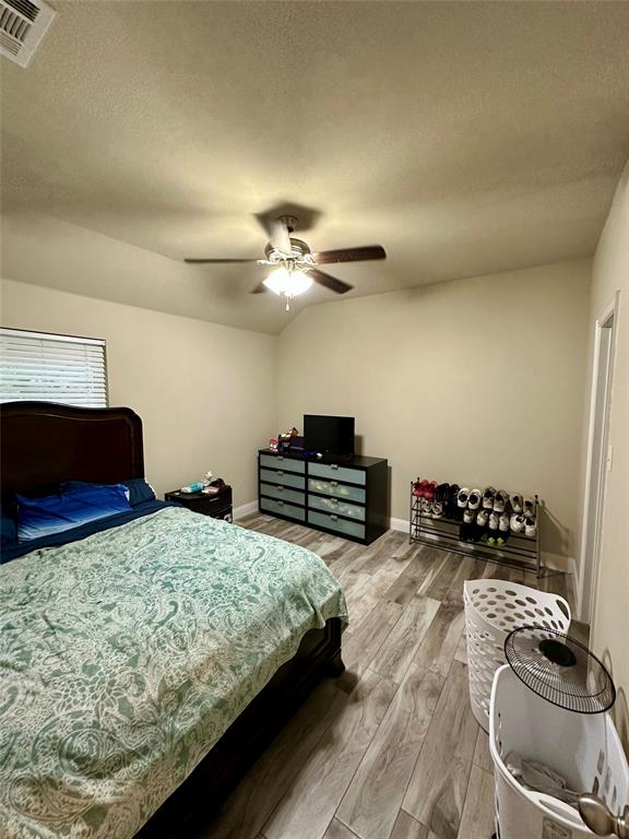 2801 Stuart Drive Fort Worth, TX 76104 - Photo 25 of 39 a bedroom with two beds and a chandelier
