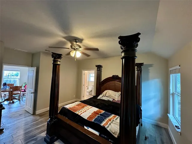 a bedroom with furniture and a window