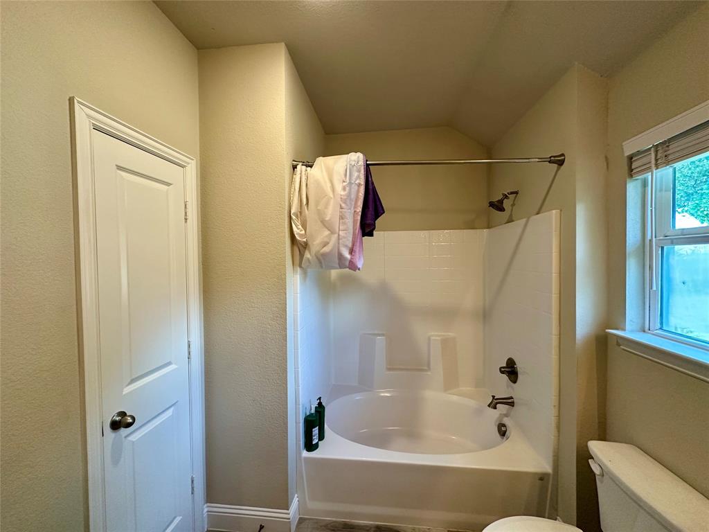 2801 Stuart Drive Fort Worth, TX 76104 - Photo 32 of 39 a bathroom with a tub and shower